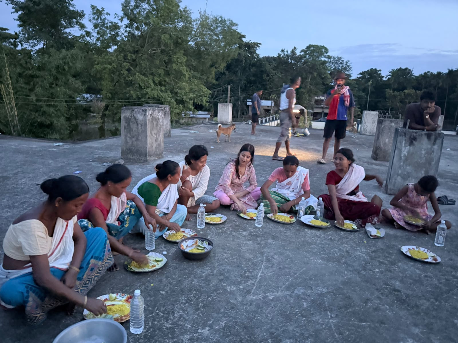 Women sharing a community meal outdoors